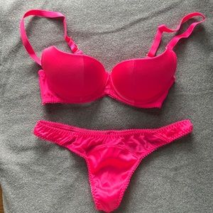 Agent Provocateur half cup push up bra and matching thong in hot pink.